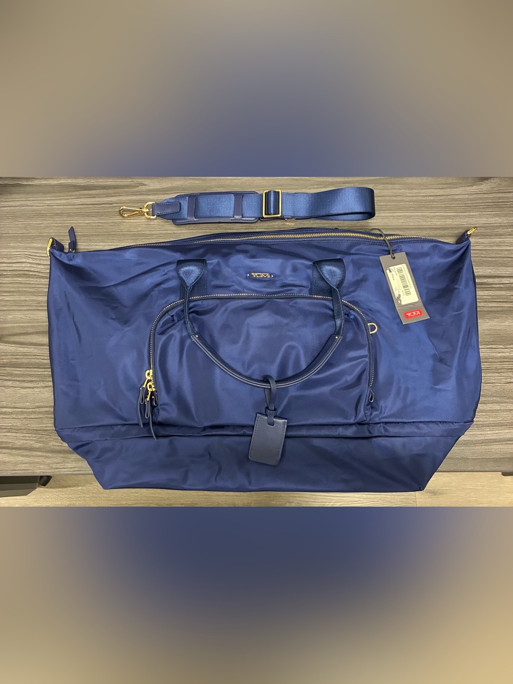 Tumi Navy Durban Expandable Duffle with Gold Hardware and Removable Strap